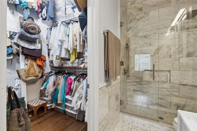 10000 SW 52nd Ave Unit 164, Gainesville, FL 32608 - walk in closet with wood finished floors