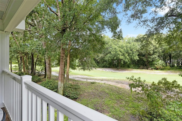 10000 SW 52nd Ave Unit 164, Gainesville, FL 32608 - view of yard with view of wooded area and a balcony