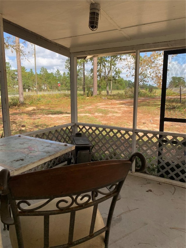 unfurnished sunroom featuring a healthy amount of sunlight