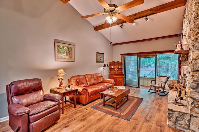 living room with beamed ceiling, light hardwood / wood-style flooring, high vaulted ceiling, and ceiling fan