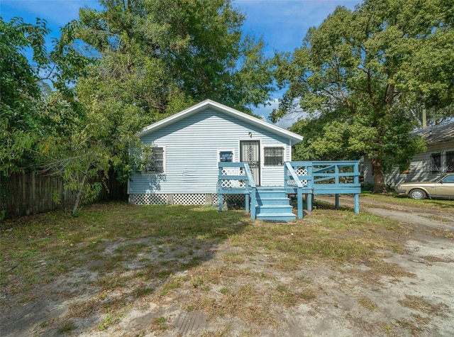 view of front of house featuring a wooden deck