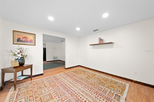 unfurnished room featuring hardwood / wood-style flooring