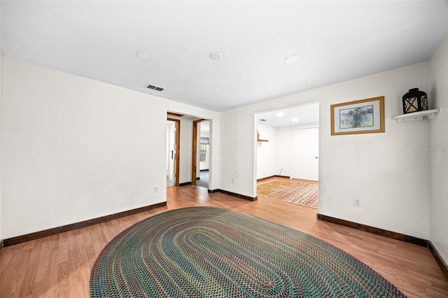 unfurnished room with light hardwood / wood-style floors