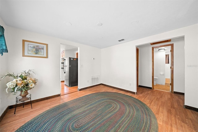 empty room featuring wood-type flooring