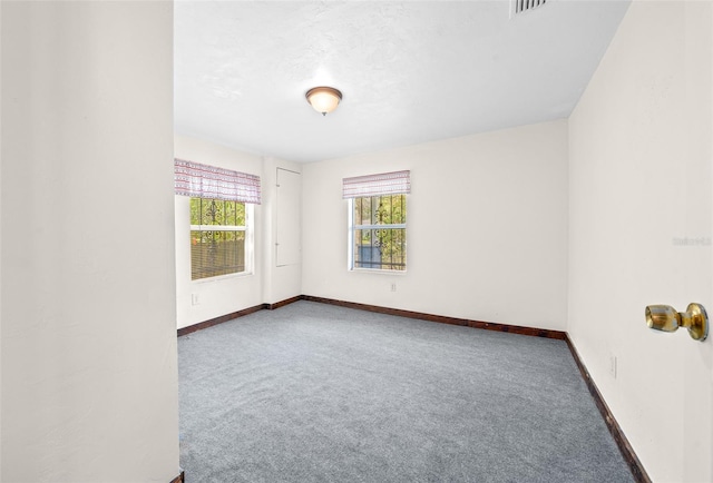 empty room featuring carpet flooring