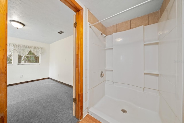 bathroom featuring walk in shower