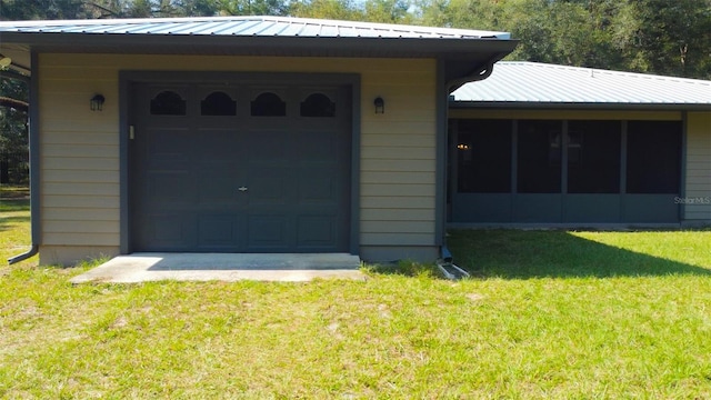 garage with a lawn