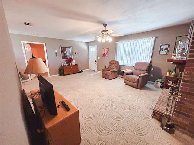 living room with ceiling fan and carpet floors