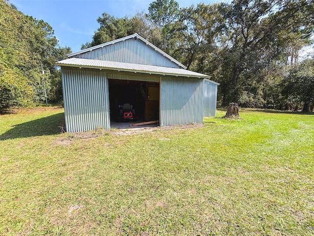 view of outdoor structure featuring a yard