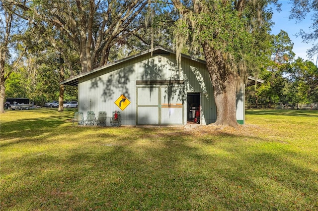 view of outdoor structure with a yard