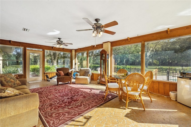 sunroom / solarium with ceiling fan