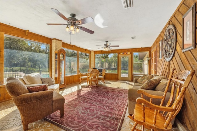 sunroom with ceiling fan