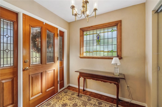 entryway featuring a notable chandelier and a healthy amount of sunlight