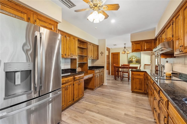 kitchen featuring tasteful backsplash, black electric cooktop, light hardwood / wood-style floors, ceiling fan, and stainless steel fridge with ice dispenser