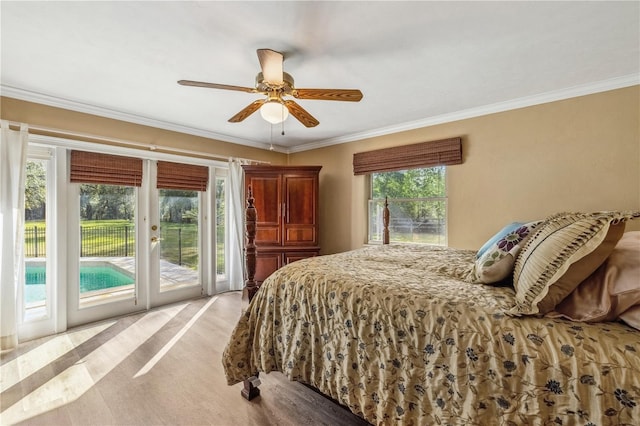 bedroom with access to exterior, crown molding, multiple windows, and ceiling fan