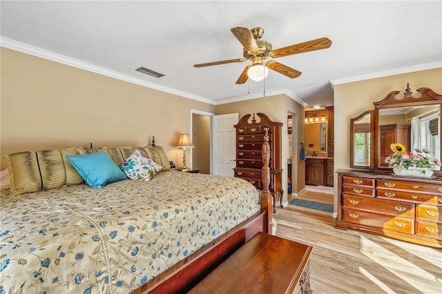 bedroom featuring light hardwood / wood-style floors, ornamental molding, ensuite bathroom, and ceiling fan