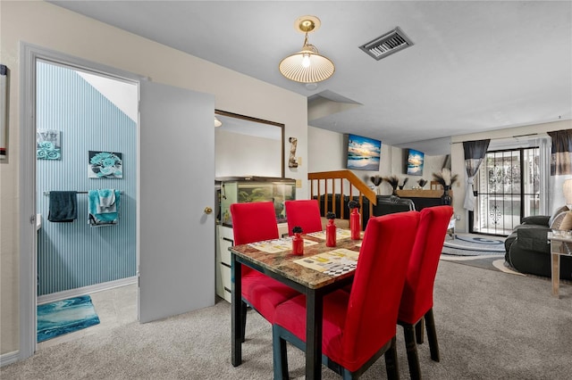 view of carpeted dining area