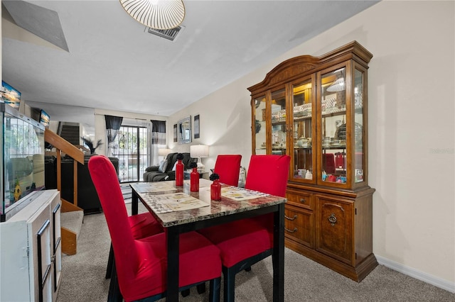 dining area with carpet