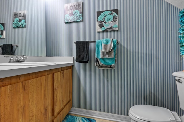 bathroom with vanity and toilet