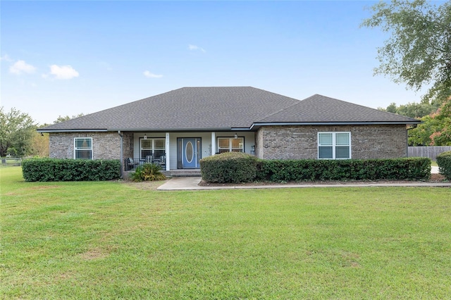 ranch-style house with a front lawn