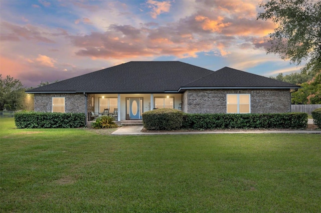 view of front of home with a yard