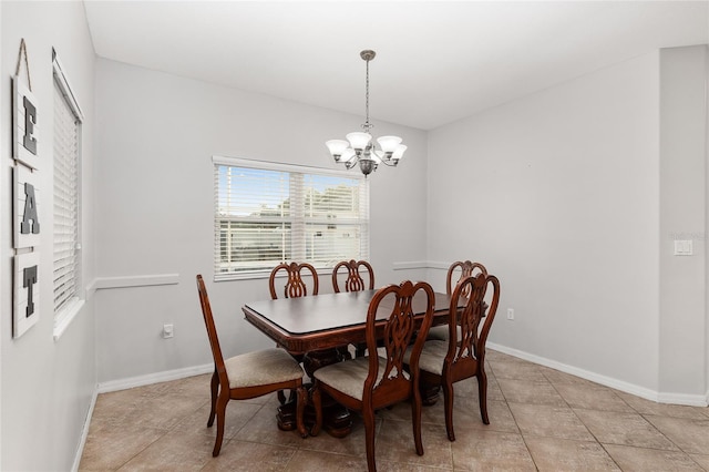 dining space with a chandelier