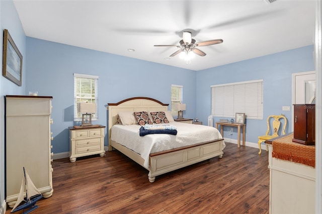 bedroom with dark wood-type flooring and ceiling fan