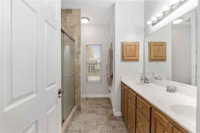 bathroom featuring vanity and a shower with shower door