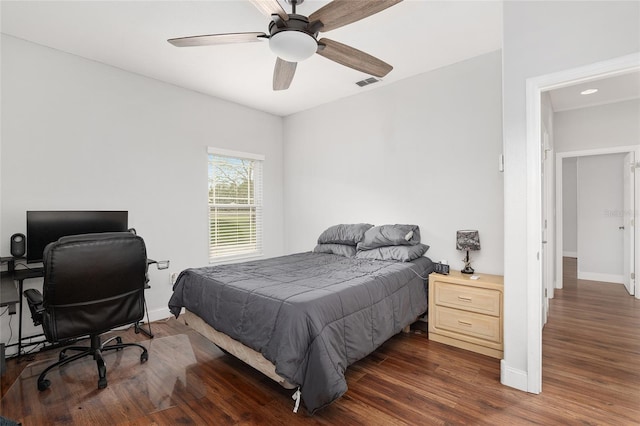 bedroom featuring dark hardwood / wood-style flooring and ceiling fan