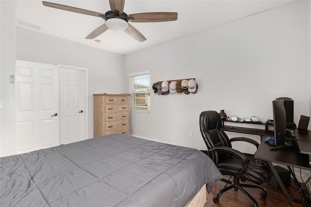 bedroom featuring a closet, hardwood / wood-style flooring, and ceiling fan