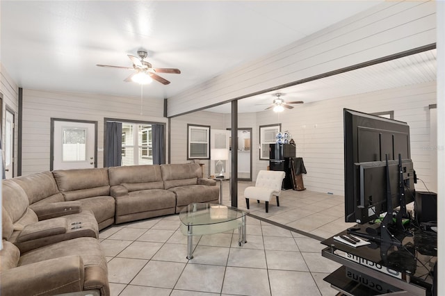 tiled living room with ceiling fan