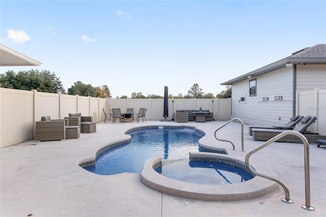 view of swimming pool with a patio and an in ground hot tub