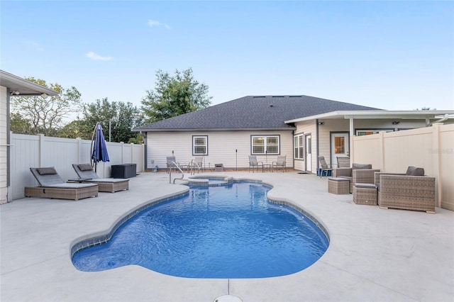 view of pool with outdoor lounge area and a patio