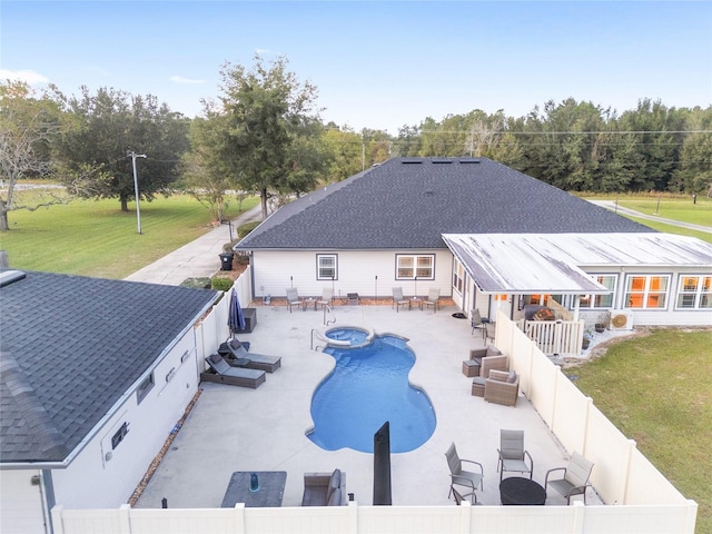 view of swimming pool featuring a patio and a yard