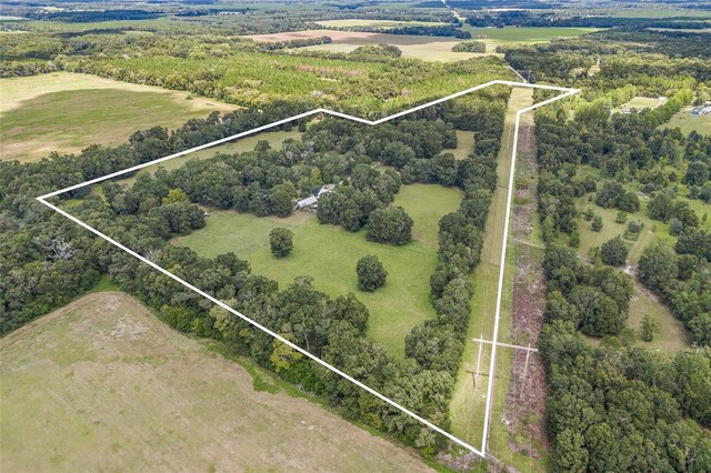 birds eye view of property featuring a rural view