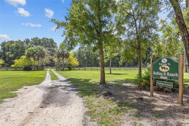 view of property's community featuring a lawn