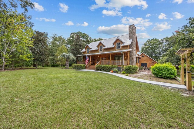 view of front of house with a front lawn and covered porch