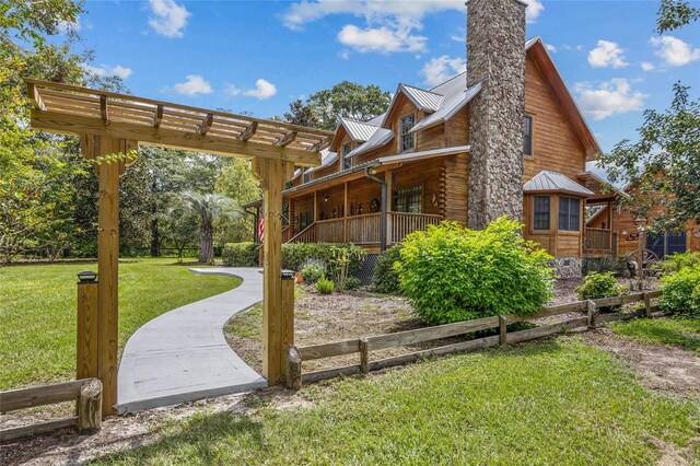 exterior space with a lawn and covered porch