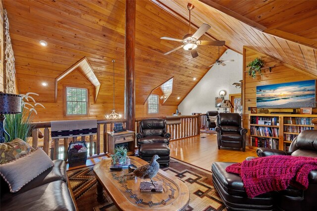 living room featuring high vaulted ceiling, hardwood / wood-style flooring, wooden ceiling, and wood walls