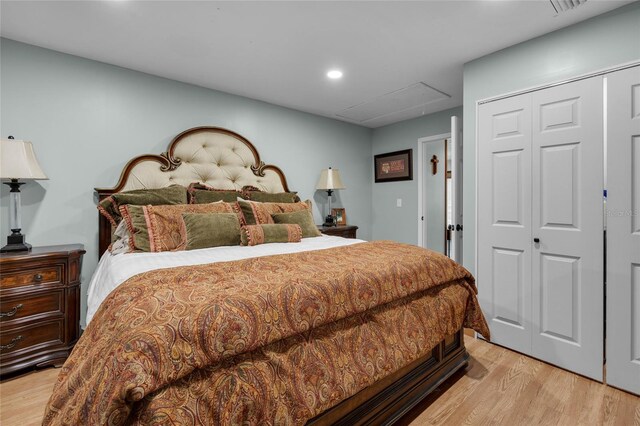 bedroom featuring a closet and light hardwood / wood-style flooring