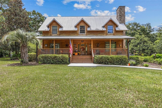 view of front of home with a front yard and covered porch