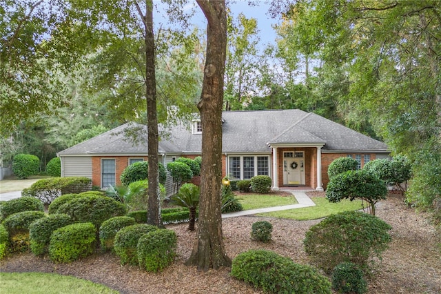 view of front of house featuring brick siding