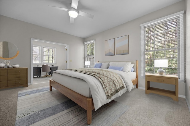 bedroom featuring baseboards and a ceiling fan