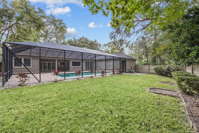 view of yard with a patio, a fenced backyard, a fenced in pool, and a lanai