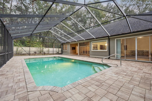 view of pool with a fenced in pool, a patio, ceiling fan, fence, and a lanai