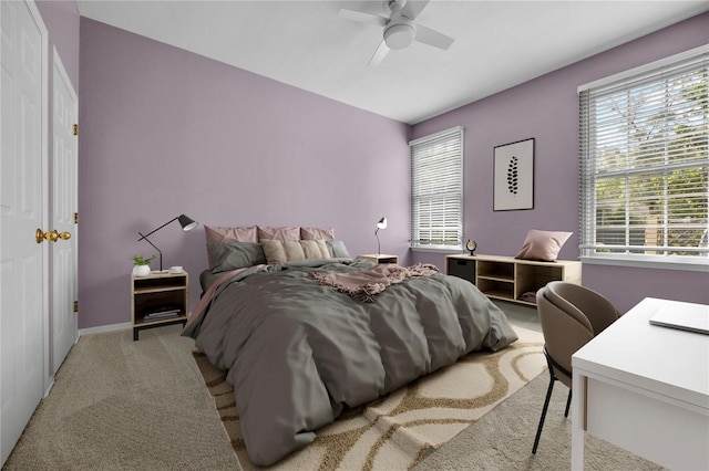 bedroom featuring carpet, baseboards, and a ceiling fan