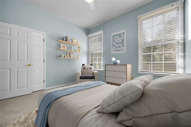 carpeted bedroom with a ceiling fan