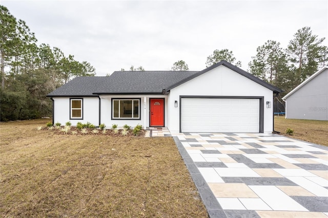 ranch-style home featuring a front yard and a garage