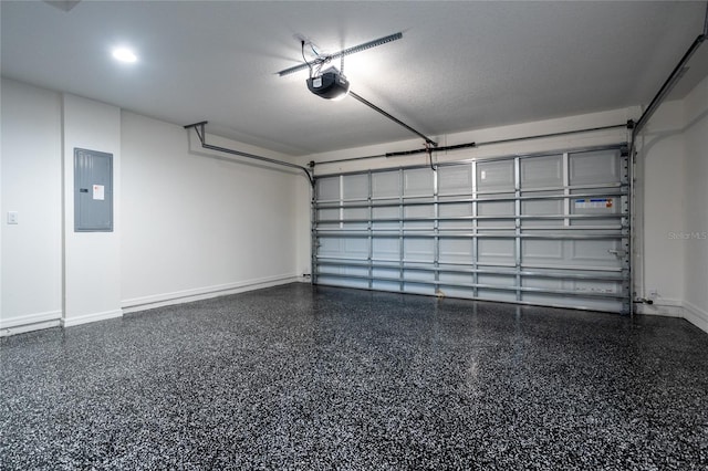 garage featuring electric panel and a garage door opener