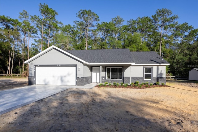 view of front of house featuring stucco siding, stone siding, a garage, and driveway